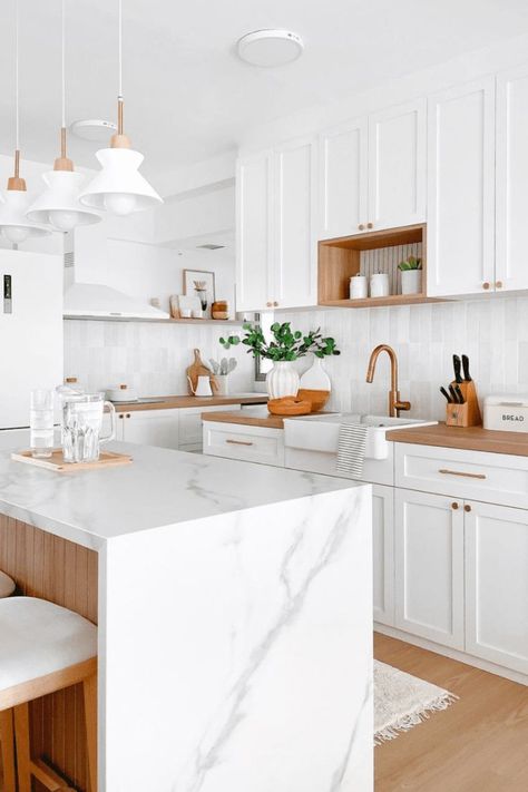 Get inspired by this bright and airy minimalist kitchen design featuring clean white cabinets, warm wood details, and a sleek marble island. Perfect for creating a modern and functional space that’s cozy yet stylish. Ideal for Scandinavian-style decor lovers! #MinimalistKitchen #WhiteAndWoodInteriors #KitchenGoals #ModernKitchenDesign #ScandinavianInteriors #MinimalistHomeDecor #KitchenInspo #WhiteKitchenIdeas #InteriorDesignUSA White Kitchen With White Island, White Wooden Kitchen, Minimalist White Kitchen, White And Wood Kitchen, White Wood Kitchens, Marble House, Marble Island, White Kitchen Island, White Kitchens