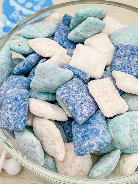 It's a Boy Puppy Chow is a perfect baby shower party food idea! This gluten free recipe is colored in blue and white to celebrate a new baby boy. A salty and sweet appetizer snack or dessert for the party. Blue Puppy Chow Recipe, Bluey Puppy Chow Recipe, Blue Colored Appetizers, Blue Theme Food Ideas, Colored Puppy Chow, Blue Platter Food, Turquoise Food Ideas, Fishing Baby Shower Food, Color Party Blue Food Ideas