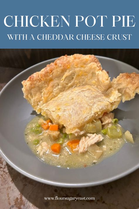 A piece of chicken pit pit on a gray plate. Veggies and gravy are spreading out under the cheddar cheese crust. Cheddar Cheese Pie Crust, Homemade Chicken Pot Pie Crust, Cheese Pie Crust, Homemade Cheddar Cheese, Chicken Pot Pie Crust, Homemade Chicken Pot Pie, Cheese Crust, Hearty Chicken, Cheese Pie