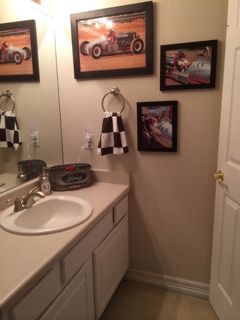 Teen boy bathroom. Vintage Race Car theme. Checkered flag towel, Ford silverware holder for toothbrushes, deodorant and toothpaste. #81 sticker on soap dispenser, which was grandpa's vintage race car number. Race Car Bathroom Ideas, Car Themed Bathroom, Teen Boy Bathroom Ideas, Manly Bathroom, Boy Bathroom Ideas, Beach Themed Bathroom Ideas, Race Car Bedroom, Boy Bathroom