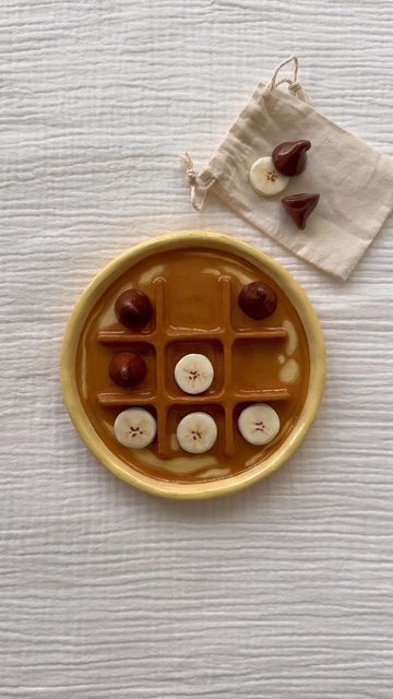 Amanda Eve on Instagram: "definitely making something else with banana slices soon because these are just the cutest   #oilpainting #tictactoe #artistoninstagram #chocolatebanana" Cute Tic Tac Toe Board Clay, Tic Tac Toe Board Clay, Amanda Eve, Clay Tic Tac Toe Board, Clay Banana, Tic Tac Toe Board, Banana Slices, Diy Ceramic, Banana Slice