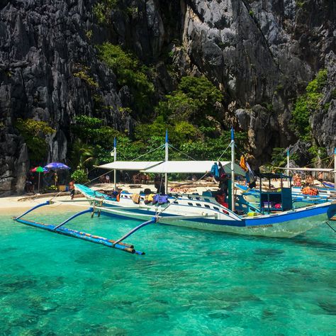 Bangka boats are *the* mode of transportation when island hopping in the Philippines. Skipping over the water in these, going from one destination to another, is just wonderful. Last time we were in the Philippines we were on one of these boats when a storm hit, which was slightly less wonderful, but an adventure all the same! Would you see the islands in a Bangka boat? #elnido #elnidopalawanphilippines #philippines🇵🇭 #tropical #boattrip #bangka #islandlife #islandhopping #sailawaywithme ... Bangka Boat Philippines, Fish Garden, Island Hopping, Boat Trips, A Storm, Island Life, The Philippines, Boats, Philippines