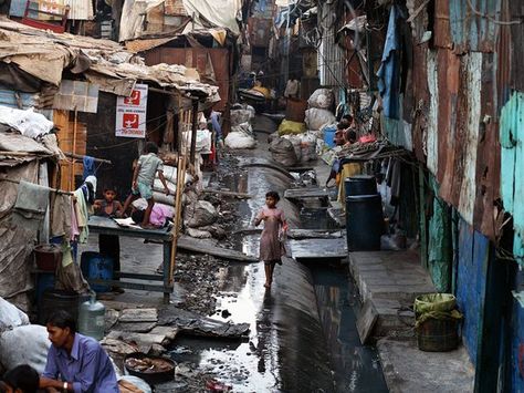 Dharavi Slum, Mumbai. Photograph by Jonas Bendiksen/National Geographic Stock. A young girl walks through Mumbai's Dharavi slum, home to about a million people. Many Indians live in modern suburbs and work in gleaming skyscrapers, but many more—a large majority—remain impoverished and trapped by tradition. Poverty In India, Urban Poverty, Shanty Town, National Geographic Magazine, Photographer Portfolio, We Are The World, Magnum Photos, Urban Area, Incredible India