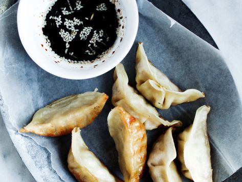 Delicious and gluten-free, these crispy dumplings feature ground pork, sweet rice flour and a sesame dipping sauce. Sesame Dipping Sauce Recipe, Sesame Dipping Sauce, Pork Potstickers, Pork Pot Stickers, Dumplings Recipes, Pork Pot, Best Dumplings, Dip Sauce, Dipping Sauces Recipes