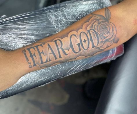 Fear God Sleeve Tattoo, Arm Tattoo Men Forearm Words, Medium Size Forearm Tattoo Men, Fire Arm Tattoo For Men, Male Arm Tattoos Forearm, Black Male Tattoos Forearm, Arm Tattoo Men Forearm Simple, Small Meaningful Tattoos For Men, Red Tattoos Men