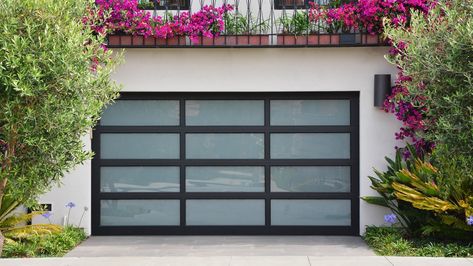 Why You Should Consider Installing A Glass Garage Door - House Digest Glass Garage Door In House, Garage Doors Glass, Glass Garage Door Walls, Garage Door Glass, Full View Garage Door, Beautiful Garage Doors, Glass Garage Doors In House, Glass Garage Door With Passing Door, Modern Garage Doors Ideas