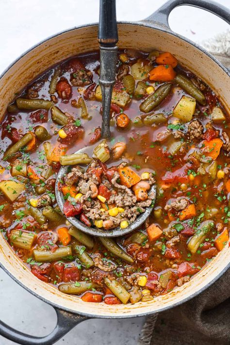 Experience the wild west in a bowl with this Cowboy Hamburger Soup recipe! This comforting blend features seasoned ground beef, veggies, and a touch of Tex-Mex, simmered to perfection in a hearty beef broth. Spicy Vegetable Soup, Vegetable Soup Crock Pot, Soup Crock Pot, Beef Soup Recipes, Soup With Ground Beef, Hamburger Soup, Slow Cooker Pasta, Vegetable Beef Soup, Soup Recipes Slow Cooker