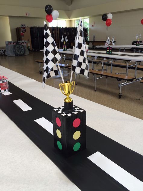 Race car - stop light center piece Made out of wood Stop Light Centerpiece, Diy Racing Party Decorations, Hot Wheels Main Table, Racecar Party Centerpieces, Race Car Centerpieces Diy, Race Car Birthday Table Decor, Race Car Birthday Party Ideas Food Checkered Flag, Race Car Themed Centerpieces, Trunk Or Treat Race Car Theme