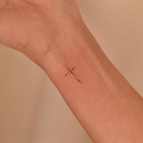 Small Cross On Wrist, Cross On Arm Tattoo Women, Cross Tattoo Fine Line, Minimalist Cross Tattoo Women, Minimalistic Cross Tattoo, White Ink Cross Tattoo, Cross Fine Line Tattoo, Delicate Cross Tattoo, Cross Minimalist Tattoo