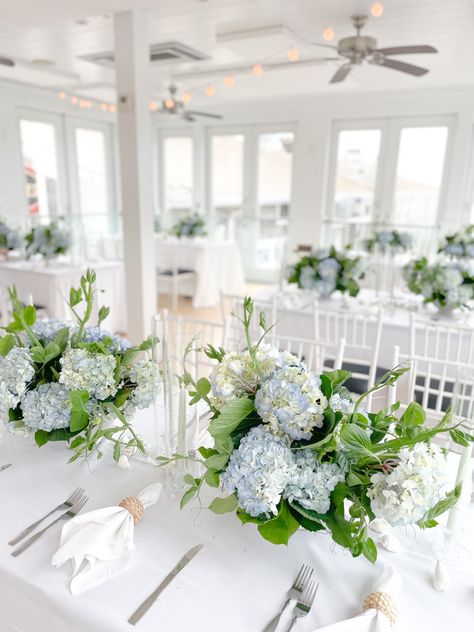 Blue hydrangea centerpieces, garden style florals with tapered candles, Newport ri Low Hydrangea Centerpiece, Blue Hydrangea Centerpieces With Candles, Hydrangeas For Wedding, Hydrangea Rehearsal Dinner, Light Blue Hydrangea Centerpiece, Hydrangea Centre Pieces, Hydrangea Wedding Flowers Centerpieces, Hydrangea And Greenery Centerpiece, Long Hydrangea Centerpiece