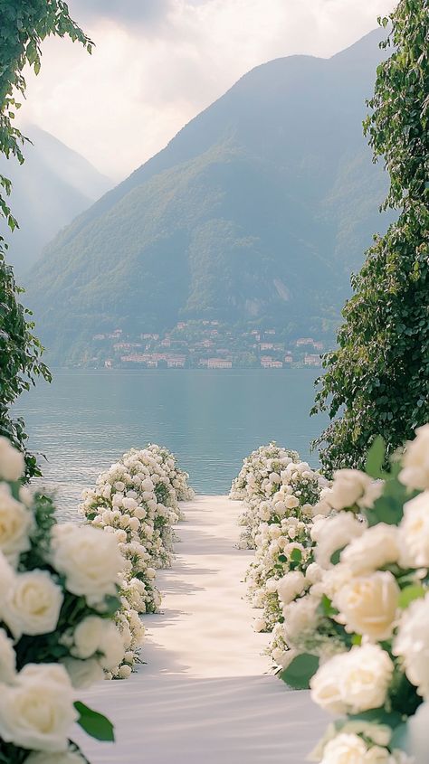 an enchanting Lake Como outdoor wedding with elegant floral decor. 🌹✨ Capture your special day in stunning detail with my wedding videography service! Let's create timeless memories together. #LakeComoWedding #OutdoorCeremony #FloralDecor #Midjourney Wedding With Flowers Everywhere, Elegant Wedding Florals, Wedding With Flowers, Enchanted Lake, Barcelona Wedding, Wedding Spain, Flowers Everywhere, Lake Como Wedding, Wedding Garden