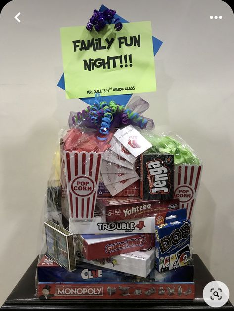 Games Gift Basket Ideas, Cornhole Raffle Basket, What To Put In A Movie Night Gift Basket, Family Fun Auction Basket Ideas, Board Games Basket Ideas, Family Game Night Raffle Basket Ideas, Family Game Night Tournament, Game Night Gift Basket Ideas Adults, Game Night Silent Auction Basket