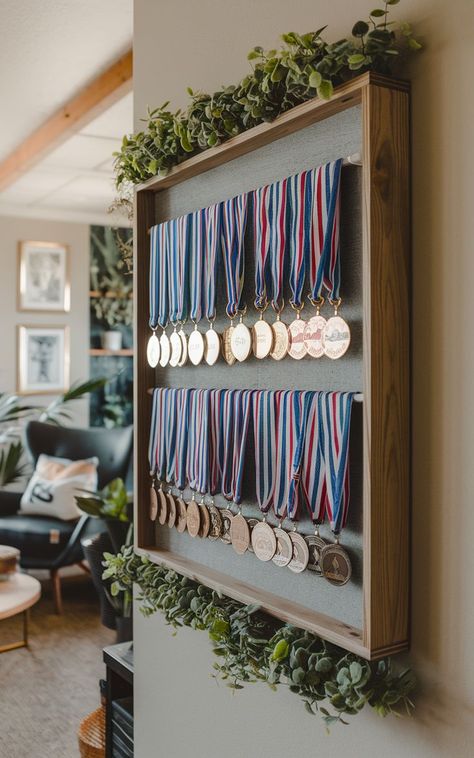 A stylish medal rack displaying a collection of race medals in a neat and organized fashion. Running Bib Display, Race Medal Displays, Sports Medal Display, Running Medal Display, Surf Room Decor, Race Medals, Medal Rack, Surf Room, Race Medal