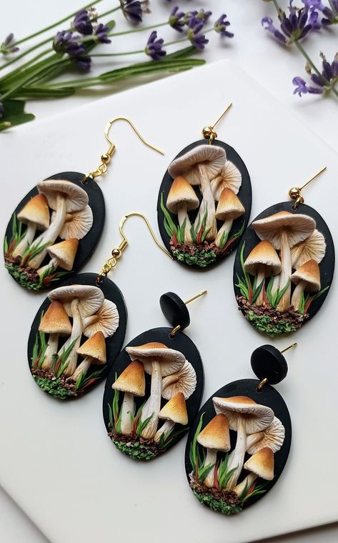 These handmade Magic Mushroom Earrings, crafted from polymer clay, are unique and dainty mushroom gifts perfect for cottage core enthusiasts, embodying whimsical jewelry. They make a charming gift for her and a nice gift for girlfriend. 🦋𝐋𝐄𝐍𝐆𝐓𝐇: 2 inches  🦋 𝐖𝐈𝐃𝐓𝐇: 1  inch  🦋 𝐌𝐀𝐓𝐄𝐑𝐈𝐀𝐋𝐒:🔹Polymer Clay 🔹Hypoallergenic nickel-free gold plated and silver plated attachment and parts🔹Attachments for sensitive ears are available upon request (please message the seller) 🦋𝐏𝐀𝐂? Polymer Clay Cameo, Polymer Mushrooms, Mushroom Clay Earrings, Polymer Clay Mushroom Earrings, Clay Mushroom Earrings, Polymer Clay Mushrooms, Cottage Core Mushroom, Mushroom Gifts, Cottage Core Jewelry