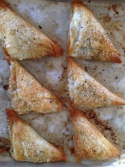 Beet Greens & Feta Stuffed Phyllo Triangles Spinach Feta Phyllo, Phyllo Feta Honey, Spinach Feta Phyllo Triangles, Feta In Filo Pastry, Spinach Feta Filo, Feta Filo Honey, Spanakopita Triangles, Phyllo Appetizers, Greek Food Recipes