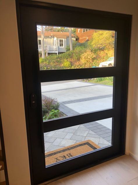 This is what we ended up with for our front door. Metal and glass custom front door from Grand Entrances San Diego. Really love it! Front Pivot Door, Front Door Metal, Custom Front Door, Large Front Door, Custom Front Doors, Pivot Door, Door Metal, Outdoor Doors, Front Door Entrance