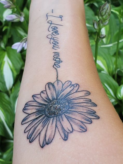 Daisy I love you more cursive forearm script tattoo Daisy Tattoo With Words As Stem, Name Daisy Tattoo, Daisy Tattoo With Name In Stem, I Love You Flower Tattoo, Love You More Tattoo Forearm, I Love You Mom Tattoo Handwriting, I Love You More Tattoo, Tattoos Writing, Momma Tattoo