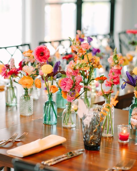 we don’t just flower weddings, we can make your bridal shower CUTE 🦋 we love these colorful bud vases! get a few to keep it demure or a million to keep it cutesy 🌸 photos by @shelbydarlingphoto Flowers In Milk Bottles, Flowers In Glass Bottles Centerpieces, Whimsical Bud Vases, Bright Bud Vases, Colorful Bud Vases, Bud Vases Wedding Centerpiece, Wedding Bud Vases, Big Boogie, Glass Bottle Centerpieces