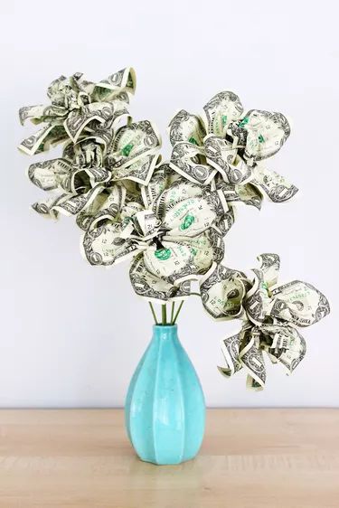 How to Make a Money Tree | eHow Toothpick Crafts, Money Leis, Money Rose, Money Art, Folding Money, Diy Graduation Gifts, Dollar Bill Origami, Money Flowers, Money Bouquet