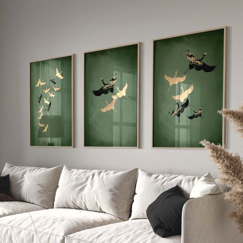 This wall art trio fuses vintage and modern to create this stunning piece for your home. The birds, taken from vintage Japanese art are overlaid with gold-toned abstract patterns and set against a textured, calming sage green background to create a beautiful gallery wall set you will treasure for years to come. Please note this design is not gold foiled. Asian Inspired Living Rooms, Painting For Hall Living Rooms, Green And Gold Abstract Art, Modern Japanese Art Print, Japandi Basement, Sage Green Office Ideas, Apartment Paintings, Modern Asian Decor, Chinese Wall Art