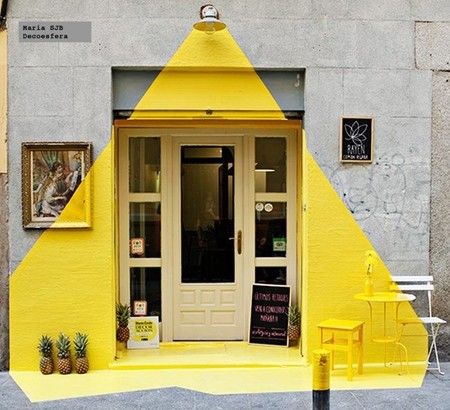 This photo is lined up to perfectly capture the execution, but without that, it would still be a really playful, clever way to draw attention to this shop front on an otherwise bland facade. Shop Fronts, Shop Front, Design Del Prodotto, Retail Space, Light Installation, Cafe Interior, Cafe Design, Mellow Yellow, Retail Design