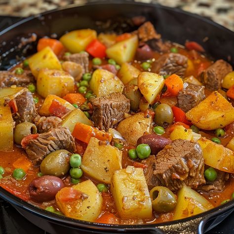 🍲 Dive into the hearty Caldereta, a Filipino beef stew! 🍖✨ #CalderetaCraze #HeartyMeals Caldereta Ingredients: Beef, cubed (2 lbs) Potatoes, cubed (2 cups) Carrots, sliced (1 cup) Tomato sauce (2 cups) Liver spread (1/2 cup) Green peas (1/2 cup) Green olives (1/2 cup) Bell peppers, sliced (1 cup) Garlic, minced (3 cloves) Onion, chopped (1) Soy sauce (2 tbsp) Salt and pepper (to taste) Instructions: In a pot, sauté garlic and onion. Add beef and cook until browned. Stir in tomato sauce, l... Filipino Beef Stew, Twisted Recipes, Dinner Plan, Trending Recipes, Green Olives, British Food, Green Peas, Chicken Dishes Recipes, Beef Stew