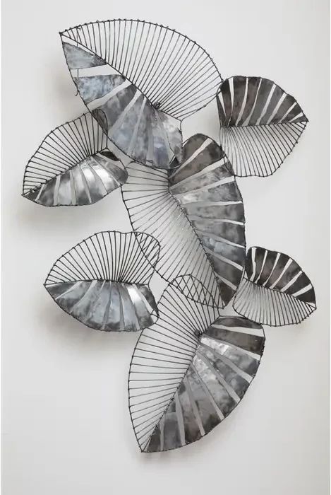 This rustic leaf wall art adds a metallic accent to contemporary interiors. Its leaves are made from a combination of recycled metal and steel wire. The juxtaposition between both materials accentuates the design. The reflective silver finish highlights the intricate detail inherent in nature. Display it in the living room or hallway. Dimensions: H89.50 x W111 x D6.50cm Delivery in 7-10 days Metal Leaf Art, Hallway Dimensions, Metal Wire Sculpture, Metal Flower Art, Nature Display, Metal Leaf Wall Art, Metal Sculpture Wall Art, Lighting Reference, Statement Lamp