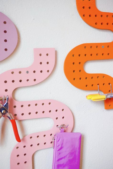 Introducing our first line of Curious pegboards! Make your workspace feel that much more unique and inspiring with our retro inspired wall-mounted pegboards. Organize a wide variety of your items and make the clutter look cute ✨Fits standard sized 1/4” metal pegboard hooks which are widely available at major hardware s Pegboard Room Divider, Pegboard Storage Ideas, Rainbow Pegboard, Craft Peg Board, Pegboard Hacks, Pegboard Desk, Van Interiors, Jigsaw Projects, Confetti Wall