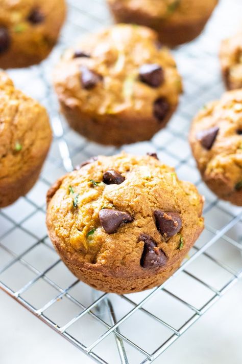 These pumpkin zucchini muffins are moist and full of flavor. Let’s bridge the gap between summer and fall with these pumpkin zucchini muffins! Chocolate Pumpkin Zucchini Muffins, Pumpkin Zucchini Chocolate Chip Muffins, Zucchini And Pumpkin Recipes, Healthy Pumpkin Zucchini Muffins, Grain Free Pumpkin Muffins, Pumpkin Zucchini Muffins, Zucchini Pommes, Fall Yummies, Pumpkin Zucchini