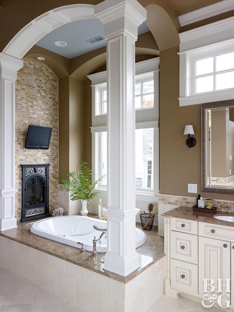 Put a fireplace in your bathroom to enjoy the sight and warmth of a roaring fire as you relax in the tub or do evening stretches. If the bathroom is attached to your bedroom, consider a double-sided fireplace for twice the enjoyment. Paired with a few other easy bathroom upgrades, a fireplace will make your master bathroom feel like an at-home spa. Evening Stretches, Small Bathroom Upgrades, Easy Bathroom Upgrades, Bedroom Upgrades, Monochromatic Room, Minimal Bathroom, Bathroom Fireplace, Double Sided Fireplace, Whirlpool Bathtub