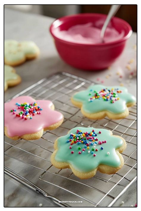 These delightful flower-shaped cookies are not just a treat for the taste buds, but also a feast for the eyes! Topped with colorful icing and fun sprinkles, they're perfect for any occasion. Join me in baking these deliciously sweet cookies that are sure to bring smiles to everyone! Sugar Cookie Frosting Recipe, Cookie Frosting Recipe, Flower Shaped Cookies, Types Of Frosting, Perfect Sugar Cookies, Cookie Toppings, Shaped Cookies, Sugar Cookie Frosting, Frosting Recipe