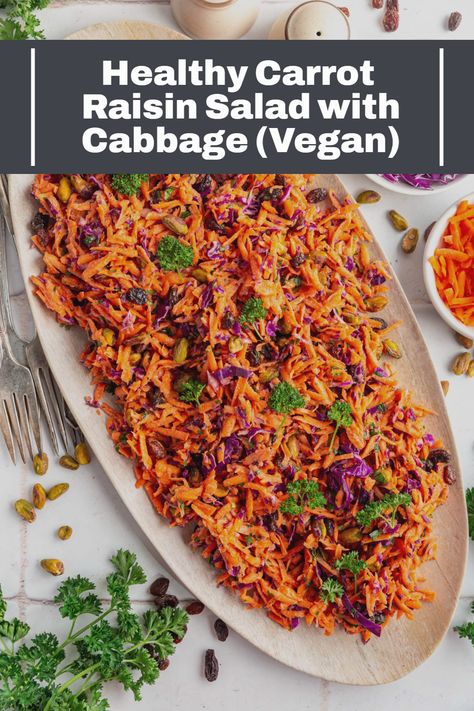 This quick and easy Carrot Raisin Salad is a healthy and delicious slaw you can throw together in minutes! Fresh carrots tossed with cabbage, raisins, pistachios, parsley and a sesame dressing. Ready in just 20 minutes! #best #plantbased #recipes #bestplantbasedrecipes #plantbasedmealseasy #easy #meals #diet #recipes #plantbaseddietrecipes #veganrecipesdinnerplantbased #veganrecipes #plantbasedmealideas #ideas #plantbasedveganrecipes #plantbasedvegan #healthy Cabbage Vegan, Salad With Cabbage, Raisin Salad, Plantbased Dinner, Salt Free Recipes, Carrot Raisin Salad, Fresh Carrots, Plant Based Recipes Dinner, Vegan Dinner Recipes Easy