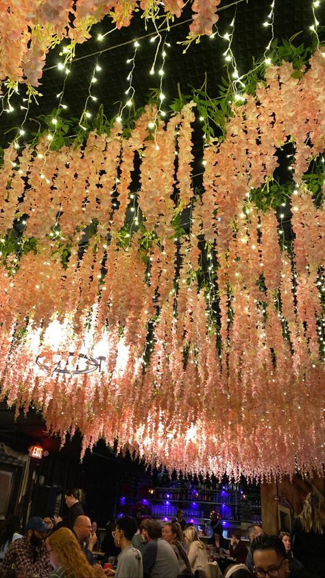 Flowers Dropping From Ceiling, Flower Ceiling Decorations, Hanging Flower Lights, Hanging Flowers From Ceiling, Blossom Birthday Party, 15 Decorations, Ceiling Flowers, Ceiling Decor Ideas, Hanging Tree Lights