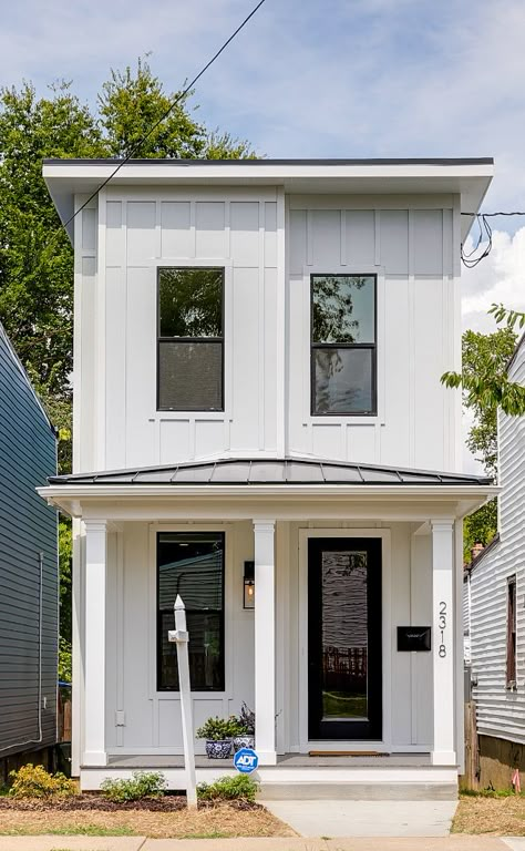 Narrow lot home This home is only 15 ft. wide so keeping the floor plan open and the design as as light and bright as possible was very important. We kept the exterior style of the home similar to the other homes on this block but we added the board and batten siding, white exterior paint, and black windows to give it an updated and on trend look. We made the front porch low to the ground to also give the home some southern charm #narrowlot #narrowhome #tinyhome #tinyhomes Small Tall House Design, Open Concept Narrow House, Narrow House Kitchen, Narrow Lot Modern House Plans, Narrow Tiny House Plans, 15 Ft Wide House Plans, Narrow Modern House Plans, Small Lot House Plans With Garage, Narrow House With Garage