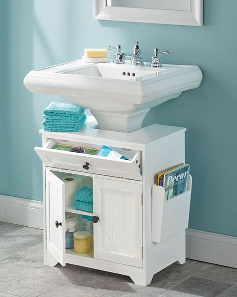 No matter how big or small your bathroom sink cabinet is, there's hope for order yet. It's all about finding creative ways to make storage happen, and these genius products might just change your life—or at least, make it just a little bit easier. From adjustable shelves to pull-out trays and lazy Susans, these are the under-sink organizers everyone needs. #storage #smartstorage #bathroomorganization Pedestal Sink Storage, Under Sink Cabinet, Small Bathroom Organization, Diy Bathroom Storage, Under Sink Storage, Sink Storage, Pedestal Sink, Sink Organizer, Small Bathroom Storage