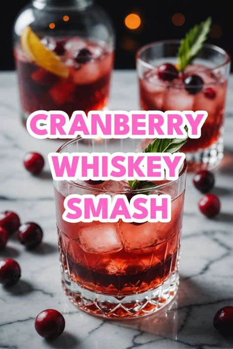 A photo of a  Cranberry Whiskey Smash which is a type of Christmas whiskey cocktails Ginger Cranberry Whiskey Cocktail, Jack Daniels Apple And Cranberry, Bourbon Cranberry Cocktail, Christmas Cocktail Whiskey, Winter Whiskey Drinks, Pecan Whiskey Drink Recipes, Christmas Whiskey Sour, Cranberry Bourbon Cocktail, Whiskey Holiday Cocktail