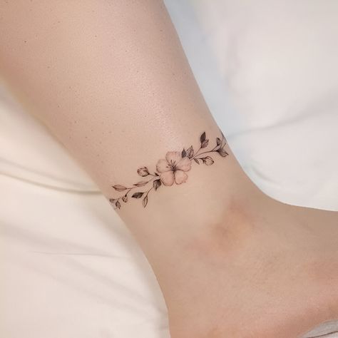 Flower Ankle Bracelet Tattoo, Wrap Around Ankle Tattoos For Women, Ankle Tattoo Flower, Anklet Tattoos Wrap Around, Feminine Ankle Tattoos, Floral Ankle Tattoo, Ankle Bracelets Tattoos For Women, Charm Anklet Tattoo, Flower Bracelet Tattoo