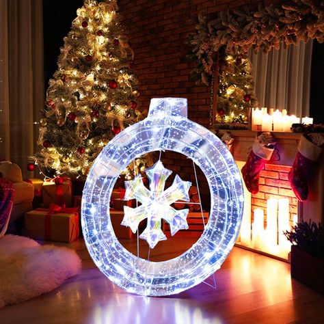 Bring some holiday cheer to your home with our 33" lighted Christmas wreath! Featuring 128 cold white LED lights, this Christmas wreath ornament is sure to brighten up your holiday season. Its versatile design includes a hanging ring and supporting bracket, allowing you to easily display it on the floor or hang it on the wall. Made from all-weather materials, this pre-lit Christmas wreath is built to last. The included metal ground stakes add to stability. Whether placed indoors or outdoors, thi Pre Lit Christmas Wreaths, Wreath Stand, Christmas Wreaths With Lights, Snowflake Wreath, Winter Magic, Saving Time, White Led Lights, Wreath Decor, Holiday Decor Christmas