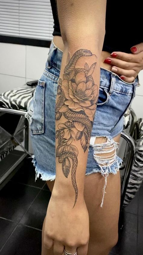 Snake Sleeve Tattoos For Women, Women Snake Tattoo Arm, Snake Tattoo Upper Arm Women, Snake Tattoo Arm Sleeve, Snake Upper Arm Tattoo Women, Women’s Snake Arm Tattoo, Snake And Flowers Tattoo, Lower Arm Tattoos, Cowgirl Tattoos