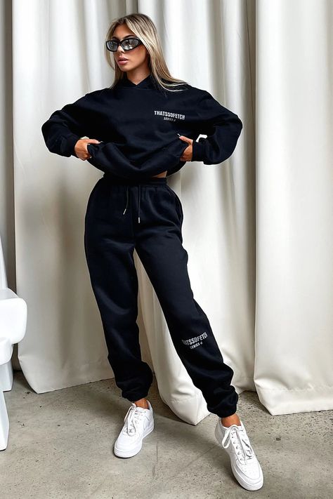 Living boujee and lounging in style! The Series 6 Sweatpants offer a soft fleeced inside, elasticated waistband with tie up drawstrings, a 'THATSSOFETCH' logo at the knee and cuffed ankles. Pair with the matching hoodie, sneakers and sunnies for a casual Sunday vibe. FABRICATION: 65% Cotton 35% Polyester SIZING: Olivia's height is 163cm / 5'3 and wears a size AU6/US2. Sweatpants Outfit Photoshoot, Cute Sweat Suit Outfits, Sweatpants Photoshoot Ideas, Nike Wardrobe, Church Photoshoot, Boutique Photoshoot, Long Cape Coat, Black Runners, Bright Color Dresses