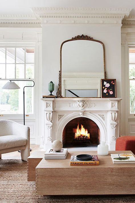 The Anthropologie mirror is basically social media famous, and I found the best Anthropologie mirror dupes online with the same antique look. Styling Anthropologie Mirror, Vintage Mirror Above Fireplace, Brass Mirror Above Fireplace, New Orleans Decor Interiors Living Room, Mirrors Over Couch Living Rooms, Gold Vintage Living Room, Large Mirror Over Fireplace Living Room, Dark Academia Fireplace Mantle, Mirror In Fireplace