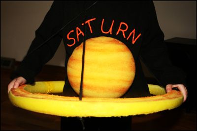 Saturn - Best Halloween Costumes For Pregnant Bellies | The Baby Post Saturn Costume, Halloween Costumes For Pregnant, Maternity Costumes, Pregnant Bellies, Pregnancy Ideas, Pregnancy Costumes, Pregnant Halloween Costumes, Best Halloween Costumes, Holloween Costume