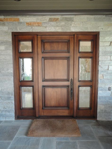 3 Panel Entry Door with 2 3-light sidelights with Seedy Reemy Glass #AntiguaDoors 3 Panel Front Door, Door With Sidelight, Panel Front Door, Rustic Entry Doors, Exterior Doors With Sidelights, Brown Front Doors, Door With Sidelights, Entry Door With Sidelights, Solid Wood Front Door