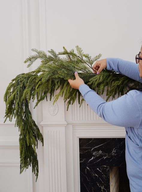 how to hang garland on mantle, how to hang garland on mantel, hang christmas garland, garland on fireplace mantel How To Hang Wreaths On Windows, Garland On Mantle, How To Hang Garland On Mantel, Christmas Fireplace Garland, Christmas Mantel Garland, Battery Operated Christmas Lights, Christmas Fireplace Mantels, Christmas Urns, Mantel Fireplace