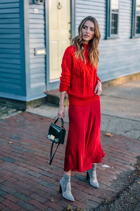 Color of the Moment: How to Wear Red this Season | Jess Ann Kirby wears red on red for a festive holiday monochromatic look Slip Dress Outfit Winter, Red Satin Skirt, Red Skirt Outfits, Red Top Outfit, Fab Frocks, Slip Dress Outfit, Trendy Party Outfits, Red Cable Knit Sweater, Red Midi Skirt