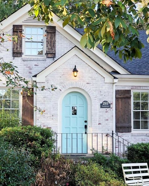 White washed brick brown shutters blue door exterior home makeover White Brick House, Brown Shutters, Exterior Home Makeover, Green Front Doors, White Wash Brick, White Brick, Blue Door, Exterior House Colors, Facade House