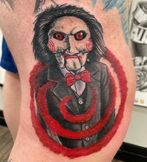 Billy the Puppet by @labrenzink Books are Closed for new projects! Call us 5875204653 . . . . . . . #saw #sawtattoo #billythepuppet #billythepuppettattoo #colortattoo #popculturetattoo #blackgoldtattooco #BGTC #crimsonempiretattoo #crimsonempire #CET #yeg #yegtattoo #yegtattoos #yegtattooshop #yegtattooartist #yeglocal #yegsmallbusiness #yeggers #shoplocalyeg #yegbusiness #yeglife Billy From Saw Tattoo, Jigsaw Puppet Tattoo, Jigsaw Tattoo Ideas, Horror Shin Tattoo, Billy The Puppet Drawing, Billy Saw Tattoo, Saw Drawing Jigsaw, Saw Horror Tattoo, Saw Tattoo Horror