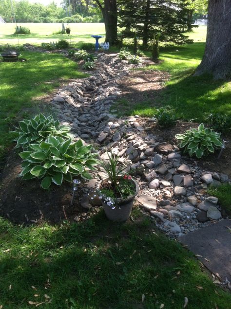 Dry creek with drain tile has improved water issues on back patio Drycreek Landscaping, Landscaping In Front Of House, Dry Riverbed Landscaping, Paver Patio Ideas, Dry Stream, Yard Drainage, Stream Bed, Drain Tile, Landscaping Backyard