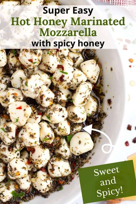 In less than 10 minutes, you can whip up this easy Hot Honey Marinated Mozzarella Balls Recipe—a super tasty twist on a classic party favorite! Just toss creamy mozzarella pearls with olive oil, a drizzle of spicy honey, and a mix of herbs and spices for that perfect combo of heat and sweet. These little bites are a total crowd-pleaser, perfect for Christmas, Thanksgiving, or New Year’s celebrations! Marinate Mozzarella Balls, Baked Mozzarella Balls, Pearl Mozzarella Recipes, Marinated Mozzarella Cheese, Pasta With Mozzarella Balls, Mini Mozzarella Ball Recipes, Mozzarella Balls Appetizers, Mozzarella Pearls Recipes, Bruschetta Recipe Mozzarella