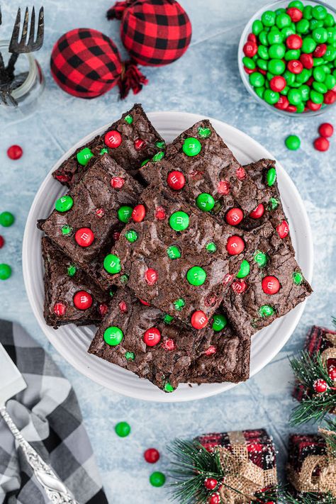 You’re going to love these delicious, fudgie brownies. The perfect dessert for the holiday season, these Christmas brownies with m&ms... The post Christmas M&M Brownies – An Easy and Quick Recipe appeared first on The Zhush. Decorated Brownies Christmas, M And M Brownies Recipe, M&m Brownies Easy, Brownie Decorating Ideas Christmas, Christmas Chocolate Brownies, Christmas Treats Cookies, Christmas Baking Brownies, Christmas Desserts Brownies, Xmas Brownie Ideas